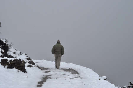 Beautiful Himalian valley with floating clouds across the ridgesの写真素材