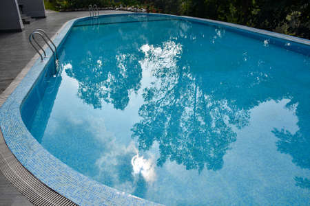 Swimming pool with blue and clear waterの写真素材