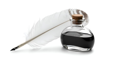 A single feather quill and ink bottle, isolated on white backgroundの素材