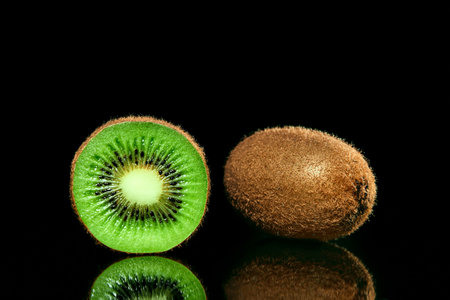 Kiwi isolated on blackの写真素材