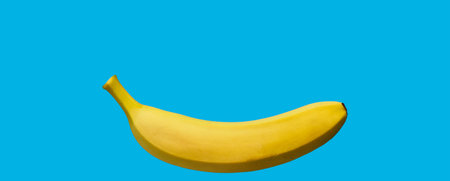 Banana isolated on blueの写真素材