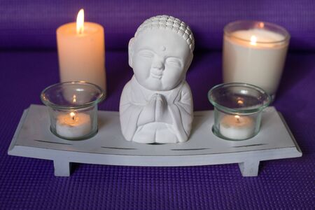 Candles and buddha in relaxation spaceの写真素材