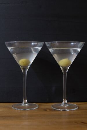 Martini glasses and on wooden tableの写真素材