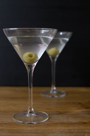 Martini glasses and on wooden tableの写真素材