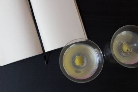 martini glasses with blank notepadの写真素材