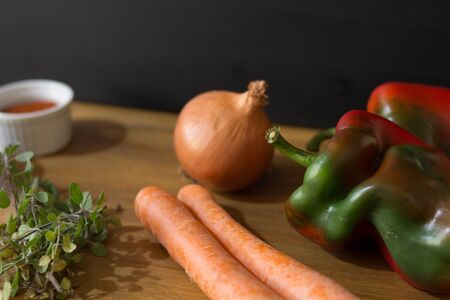 vegetables and spices on woodの写真素材