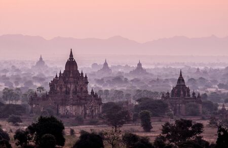 Amazing sunrise with the ancient architecture of a thousand Pagodas in Bagan Kingdom, Myanmarの写真素材