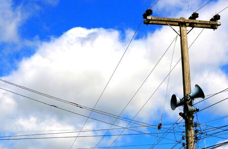 The sky is blue with clouds. Rural broadcasting tower Public relations newsの写真素材