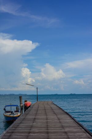 Wooden pier on the sea with clear blue skyの写真素材