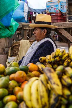 Peruvian old seller woman in the Pisac food marketのeditorial素材