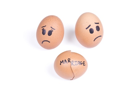 Broken marriage concept  She egg and he egg behind broken egg