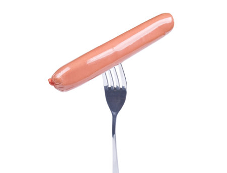 Sausage on a fork isolated over white backgroundの写真素材