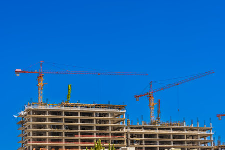 The subject of the photo is the construction of a building of a business center or residential buildingの写真素材