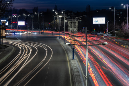 Tashkent, Uzbekistan - March 6, 2023: Road traffic of cars with blurred auto headlightsのeditorial素材