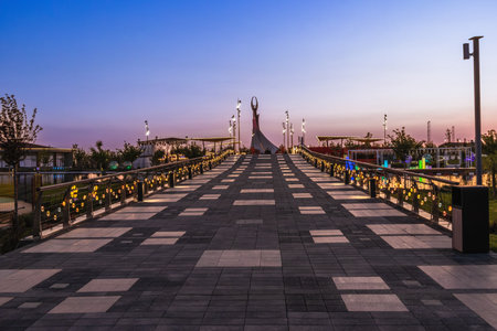 Tashkent, Uzbekistan - April 19, 2023: Memorial of Freedom and Independence in the form of a pyramid on the square of the city park "New Uzbekistan" (Yangi Uzbekistan) with a tower where the Humo birdのeditorial素材