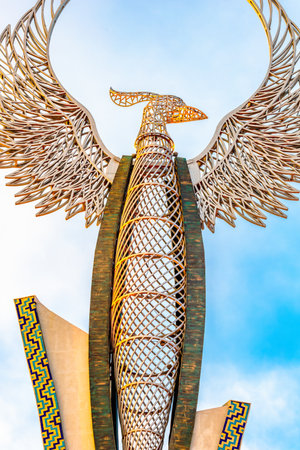 Tashkent, Uzbekistan - April 27, 2023: Memorial of Freedom and Independence in the form of a pyramid with a structure of national color on the square of the city park "New Uzbekistan" (Yangi Uzbekistan) with a tower where the Humo birdのeditorial素材