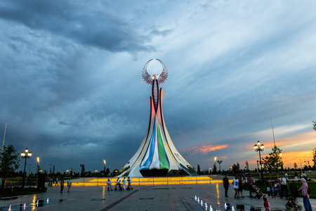 Tashkent, Uzbekistan - April 19, 2023: Memorial of Freedom and Independence in the form of a pyramid with a structure of national color on the square of the city park "New Uzbekistan" (Yangi Uzbekistan)のeditorial素材