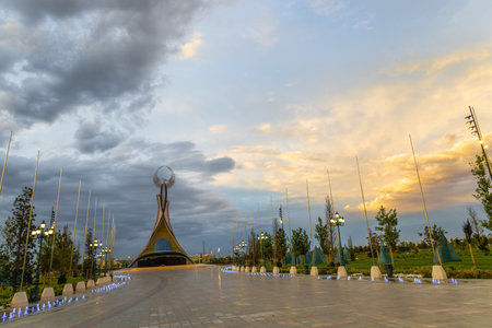 Tashkent, Uzbekistan - April 19, 2023: Memorial of Freedom and Independence in the form of a pyramid with a structure of national color on the square of the city park "New Uzbekistan" (Yangi Uzbekistan)のeditorial素材