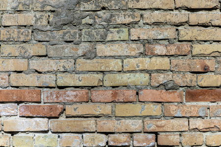 Aged concrete wall with rough weathered old surface with cracked cement in grunge style.