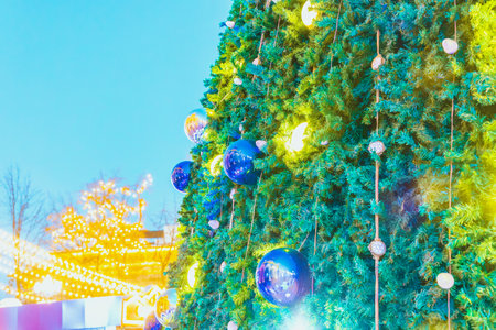 Background with blur on the theme of Christmas or New Year with toys and shining elements.の写真素材