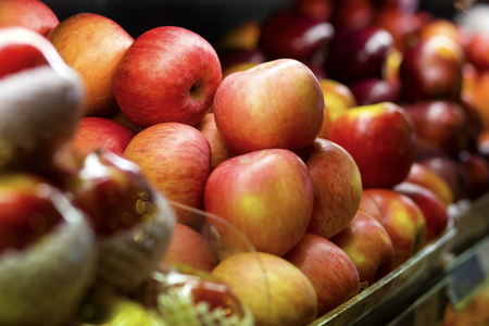 Fresh red apples on shelve in the supermarket