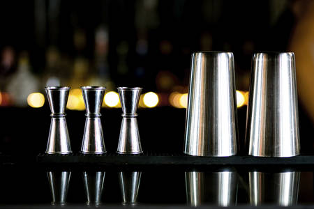 Stainless steel cocktail Measure Jigger and Stainless steel glass at cocktail bar for  prepare a fresh cocktailの写真素材