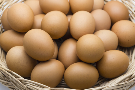 Fresh organic chicken Eggs in the basket made form rattanの写真素材