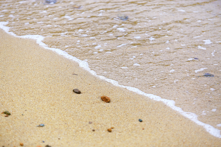 Soft waves of the sea on the sand beach,Selective Focusの写真素材