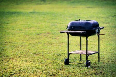 kettle barbecue grill in the garden or lawn at picnic area in the morningの写真素材
