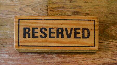Reservation sign with wood textureの写真素材