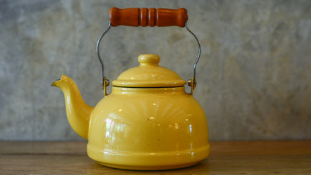 Orange teapotの写真素材