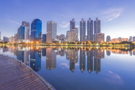 reflection of the city building from the park view before the sun riseの写真素材