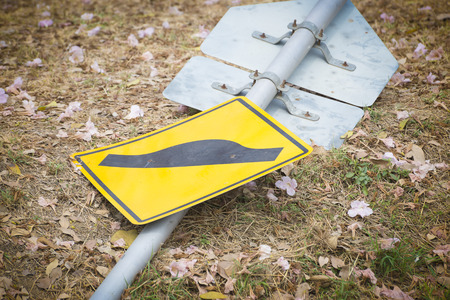 the damage traffic sign on the groundの写真素材