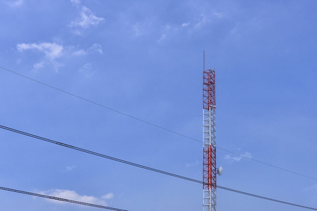 Antenna tower,antenna tower building with the blue sky.Close-up of the antenna building with the sky background.Communication antenna tower with the sky background in close-up scene.の写真素材