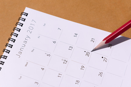The 2017 new year calendar  on the brown paper background with pencilの写真素材