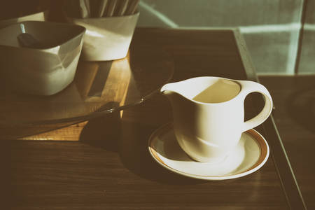 The coffee cup with the morning light in retro sceneの写真素材
