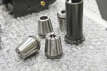 The tool collets set on the bubble absorb with component.The CNC machine componentの写真素材