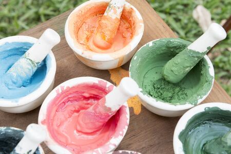 The color powder in the mortar at the grass fieldの写真素材