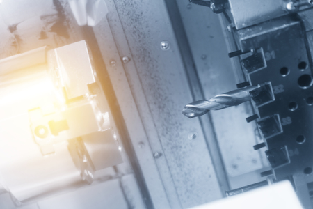 CNC lathe machine or turning machine drilling  the metal  part .Hi-precision CNC machining concept.の写真素材