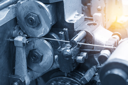The machine for pin manufacturing.The wire feeder machine with light blue scenes