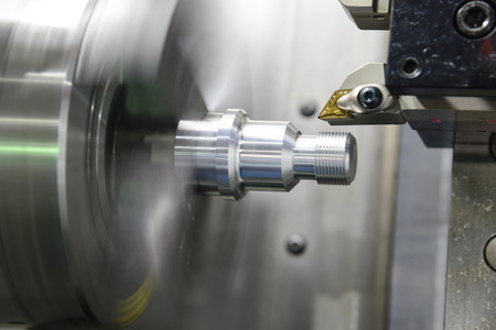 CNC lathe machine (Turning machine) cutting the metal  screw thread part .Hi-precision CNC machining concept.の写真素材