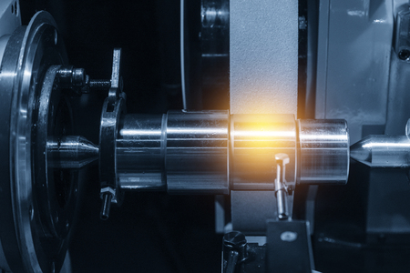 The cylindrical grinding machine with the steel shaft.Hi precision manufacturing concept.の写真素材