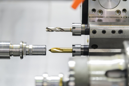 CNC lathe machine or Turning machine drilling  the steel rod .Hi technology manufacturing process.の写真素材