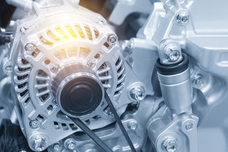The car alternator in the light blue scene with the lighting effect.Automotive part.の写真素材