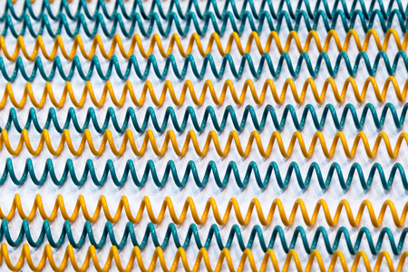 Close up of the coil spring on the white background.