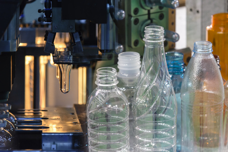 Abstract scene of  blowing bottle process  and  plastic bottle product.The Plastic bottle manufacturing process.の写真素材