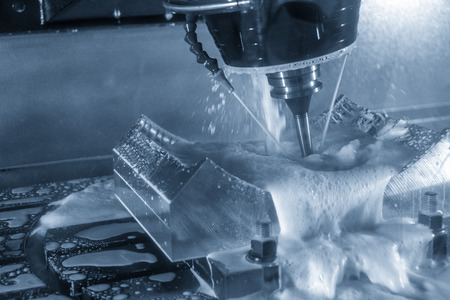 The 5 axis CNC machine cutting the automotive part with the solid ball end mill.の写真素材