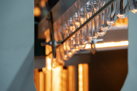 The preform shape of plastic bottle product in the heater for preheating process.Plastic bottle container manufacturing process.の写真素材