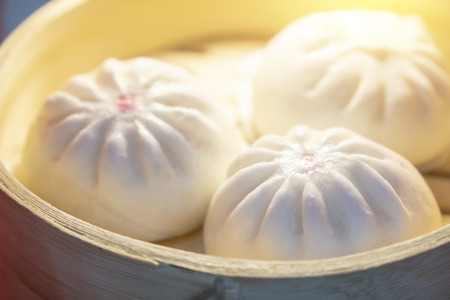 The steam buns in the bamboo basket.The Chinese traditional food.の写真素材