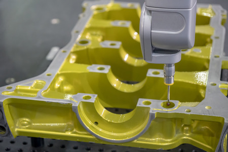 The multi-axis CMM machine measure the aluminum automotive part .The automotive part quality control concept.の写真素材